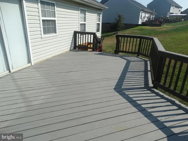 a view of a house with a backyard and porch
