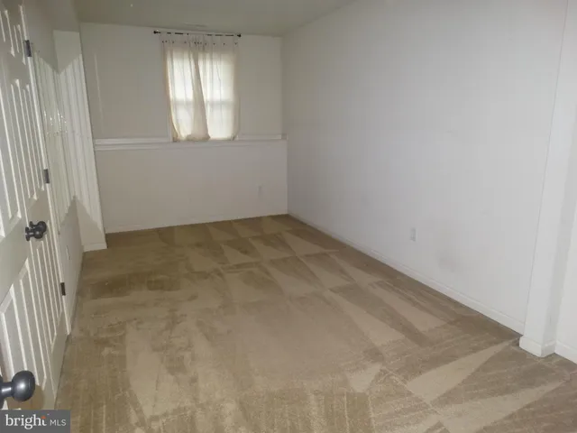 a view of empty room with windows