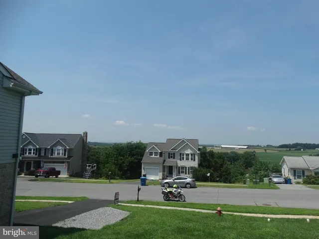 a view of a park with houses