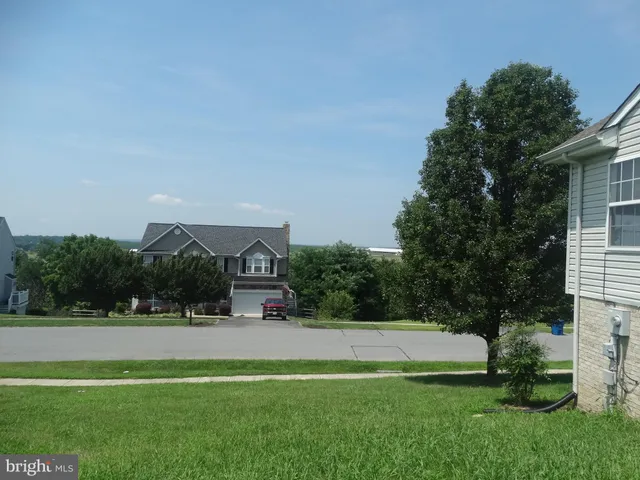 a view of swimming pool with a yard