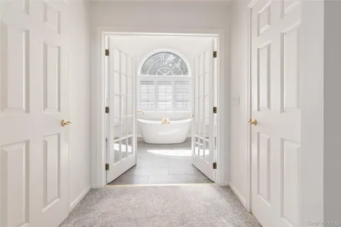 a spacious bathroom with a toilet and a shower