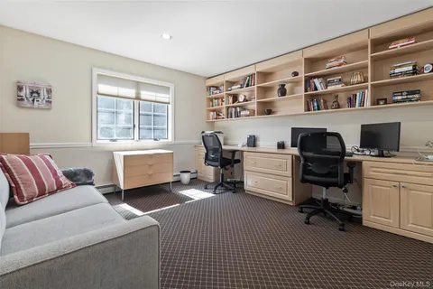 a workspace with furniture and a window