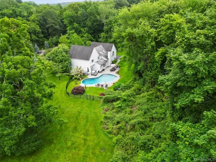 a backyard of a house with lots of green space