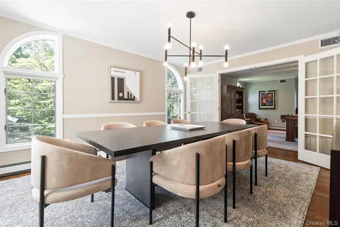 a view of a livingroom with furniture window and wooden floor