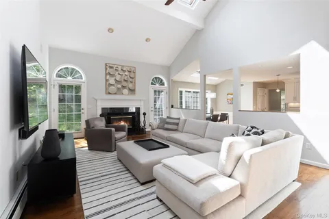 a living room with furniture or couch and a large window