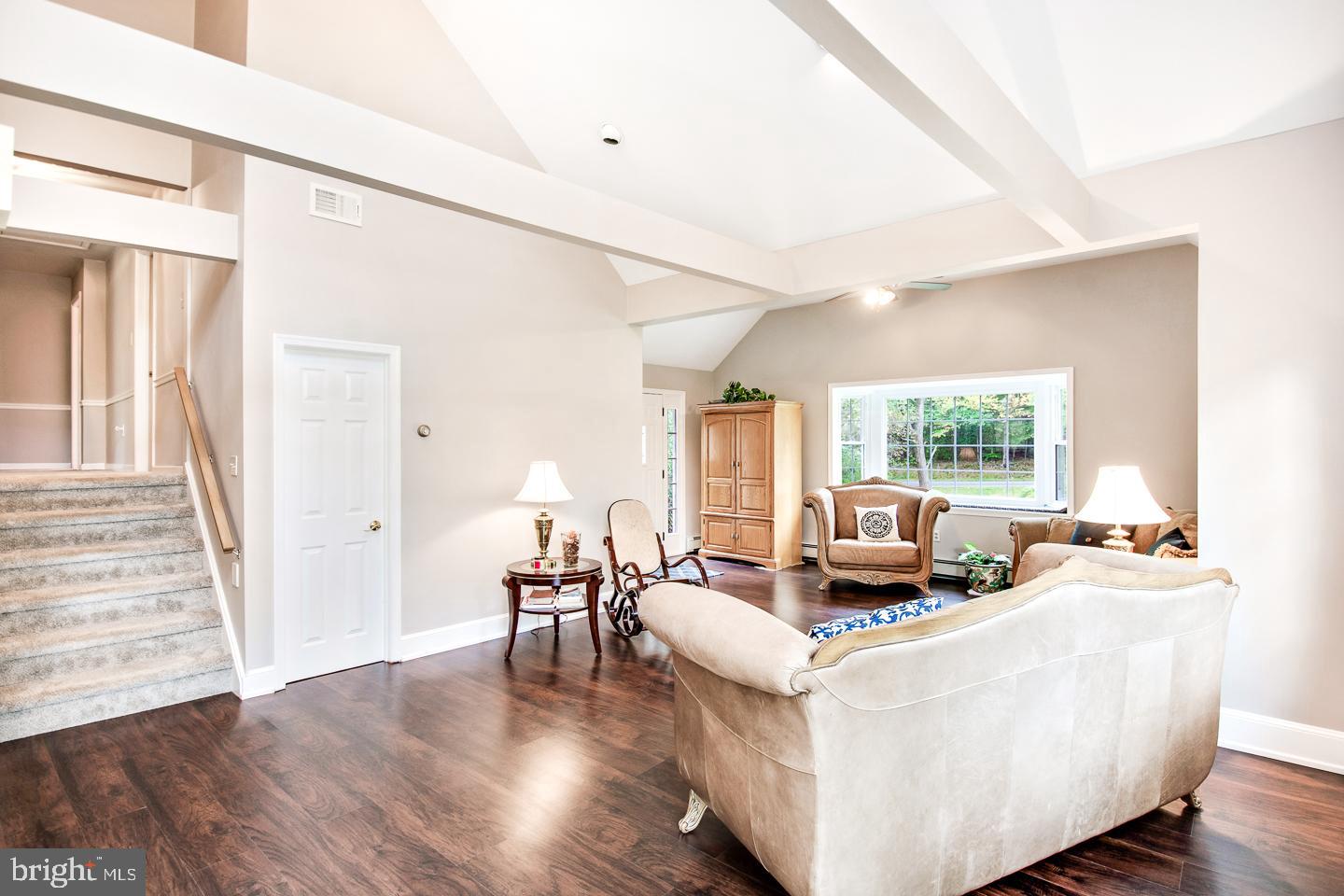 11 Aqueduct Road Newtown, PA 18940 - Photo 4 of 34 Sitting area with exposed beams