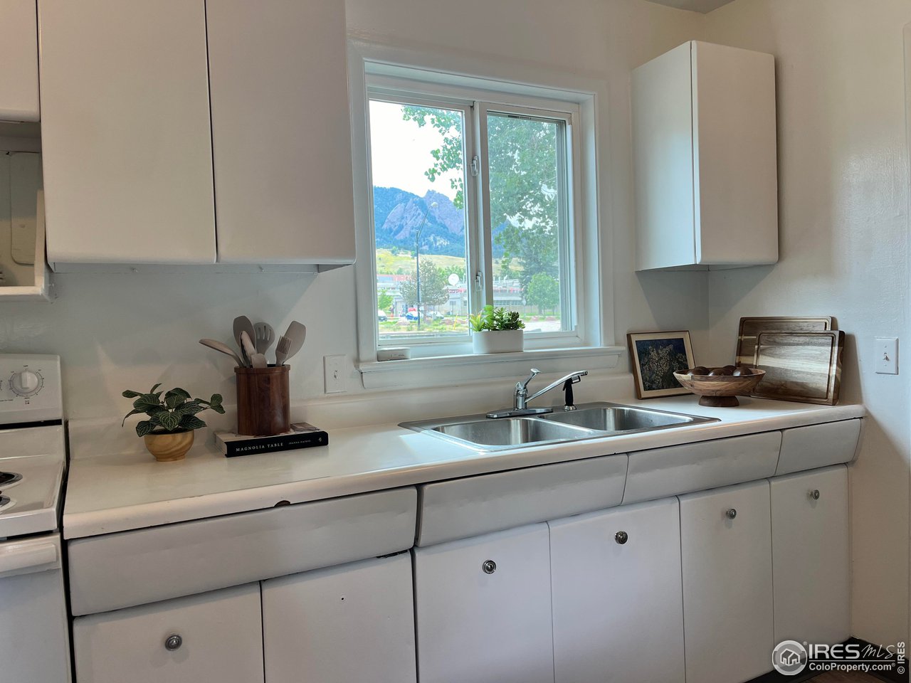 300 27th Street Boulder, CO 80305 - Photo 5 of 21 a kitchen with a sink cabinets and window