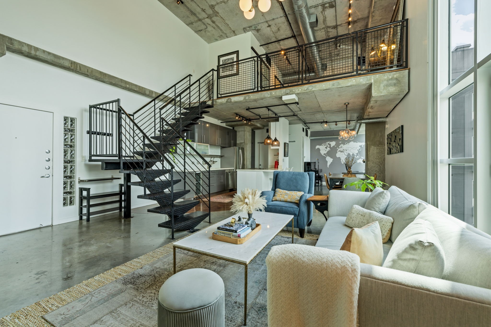 2000 Bagby Street, Unit 11415 Houston, TX 77002 - Photo 33 of 35 This impressive open-concept floor plan exudes space and comfort with all of the modern updates you can imagine. Soaring ceilings, polished concrete flooring, floor to ceiling windows, exposed ductwork, and metal stairs showcase this industrial loft.