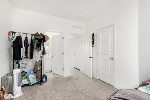 a kitchen with stainless steel appliances kitchen island granite countertop a stove and a refrigerator