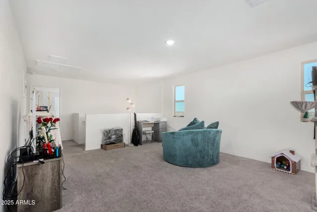 a bedroom with bed and a window