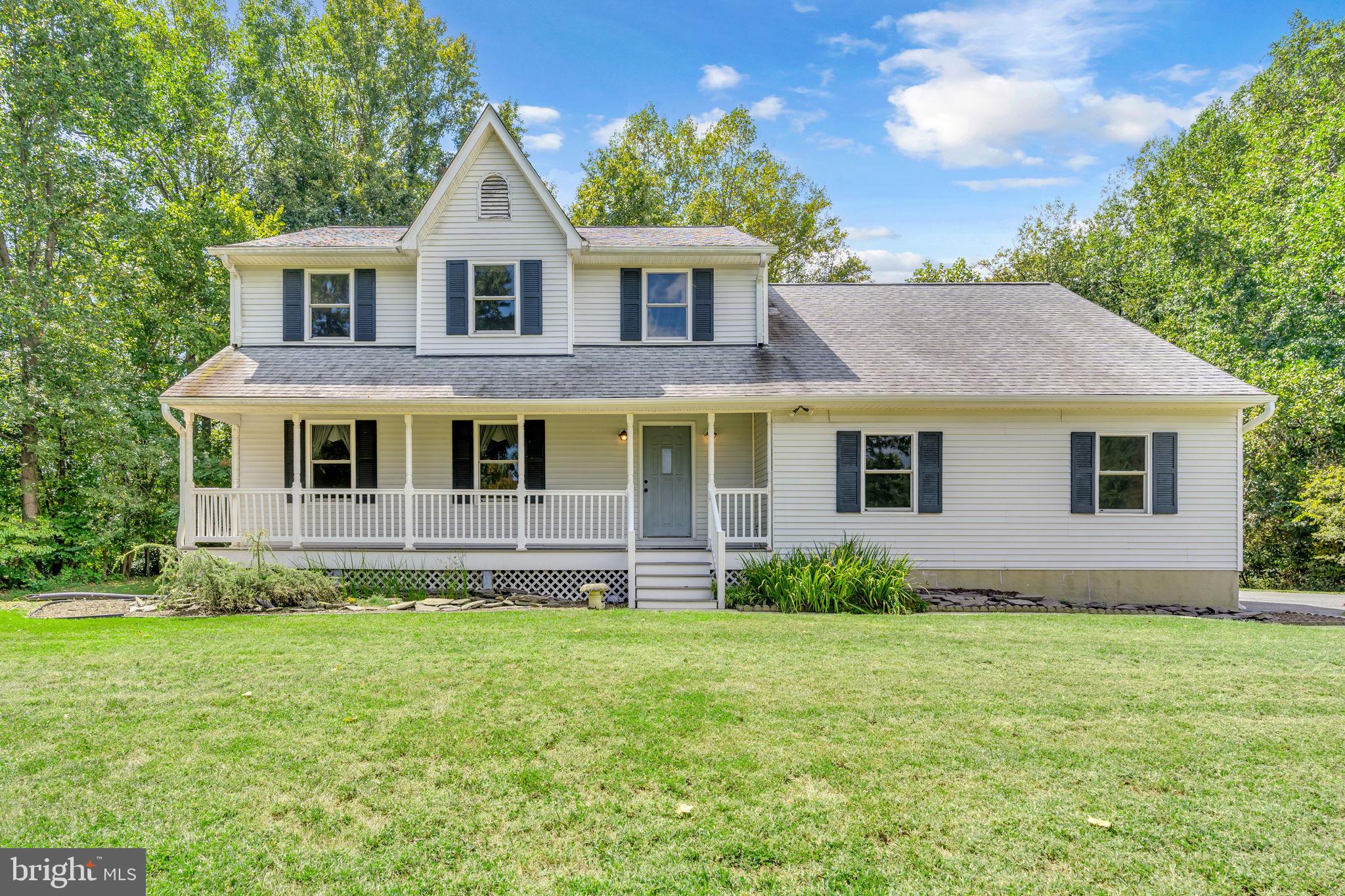 9788 Howes Road Dunkirk, MD 20754 - Photo 1 of 41 a front view of a house with garden