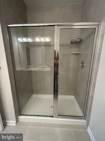 a bathroom with a sink and a shower