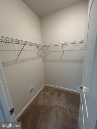a bathroom with a sink mirror vanity and toilet
