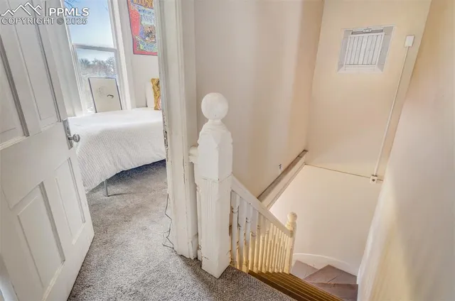 a view of a hallway with windows and entryway