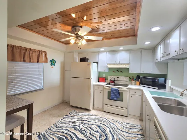 a kitchen with a refrigerator a sink and dishwasher
