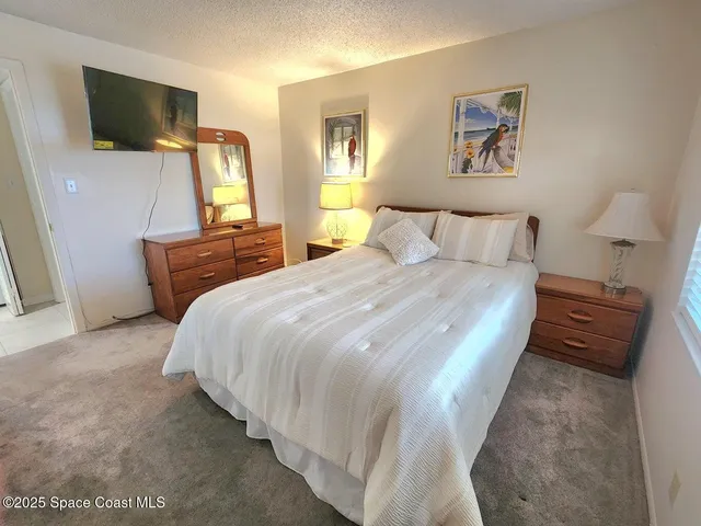 a bathroom with a toilet a sink and a mirror