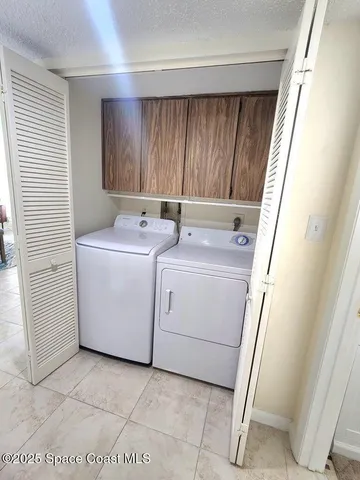 a view of swimming pool with a table and chairs