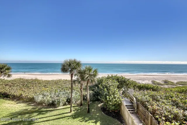 a view of a swimming pool with an outdoor seating