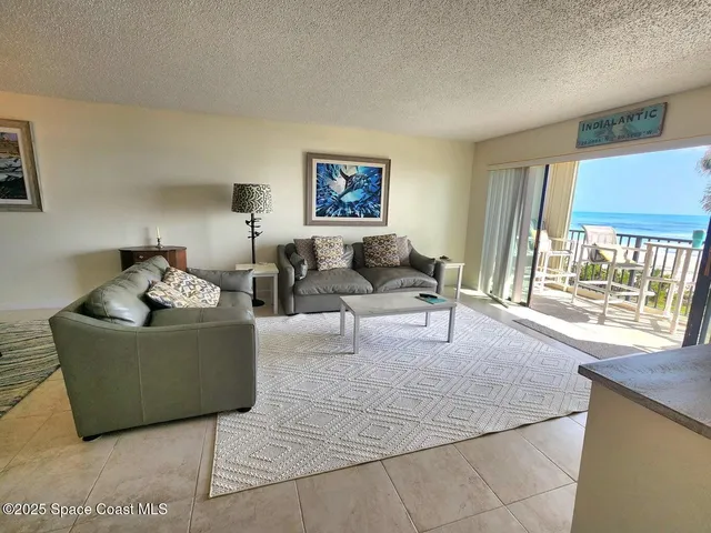 a workspace with wooden floor and furniture