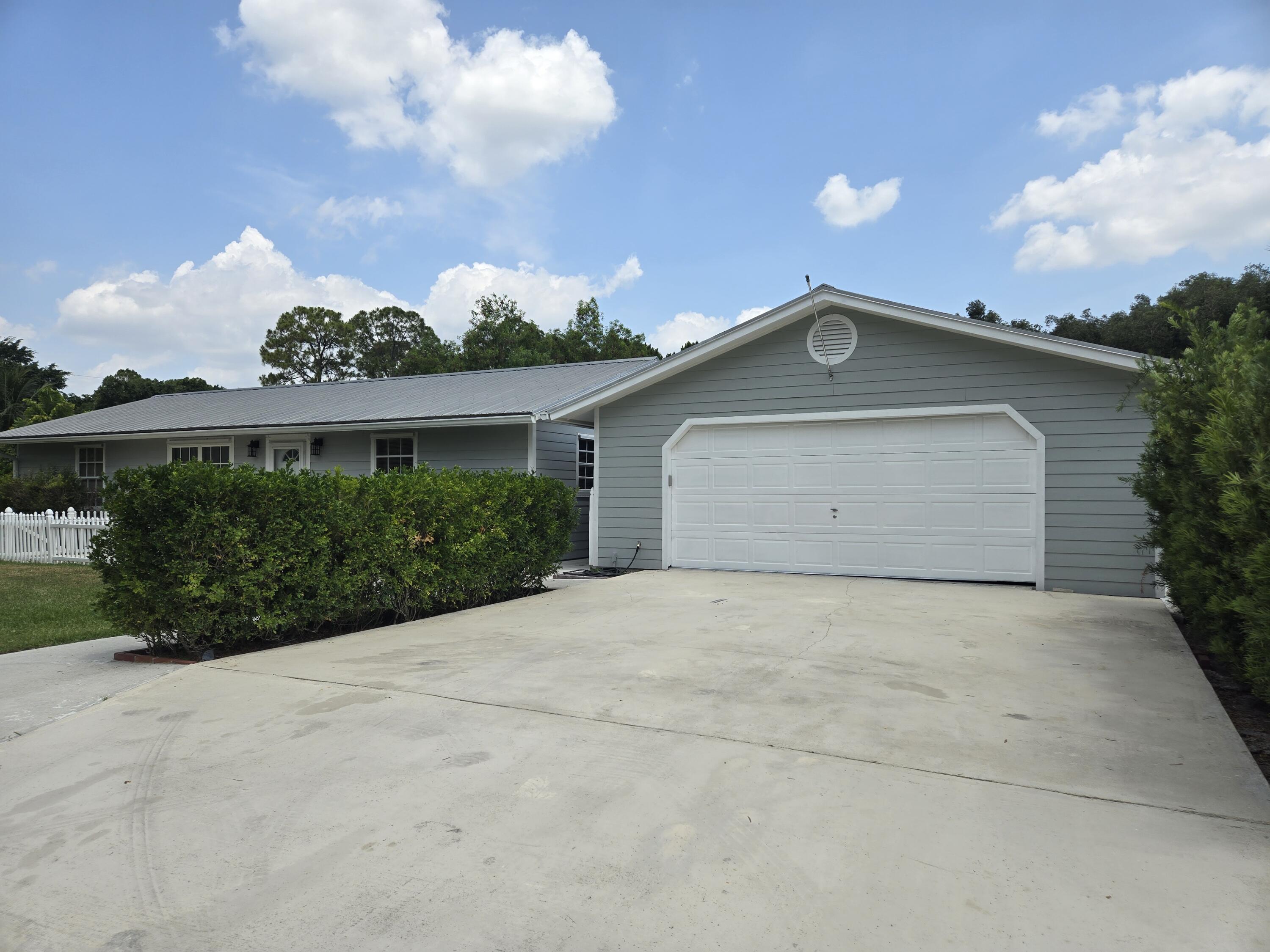 12745 165th Road North Jupiter, FL 33478 - Photo 4 of 13 Garage 5-22-24