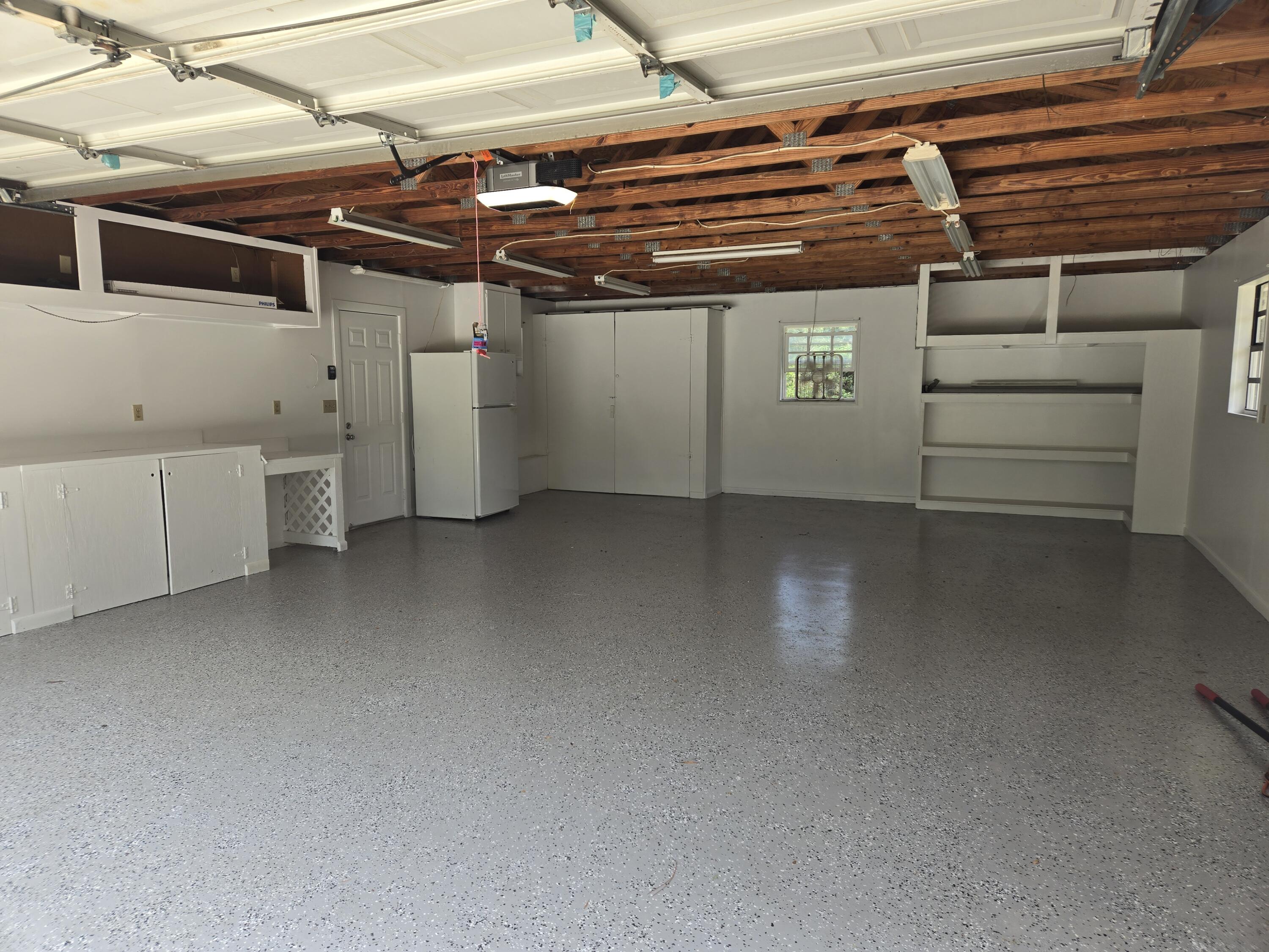 12745 165th Road North Jupiter, FL 33478 - Photo 5 of 13 Garage inside 5-22-24