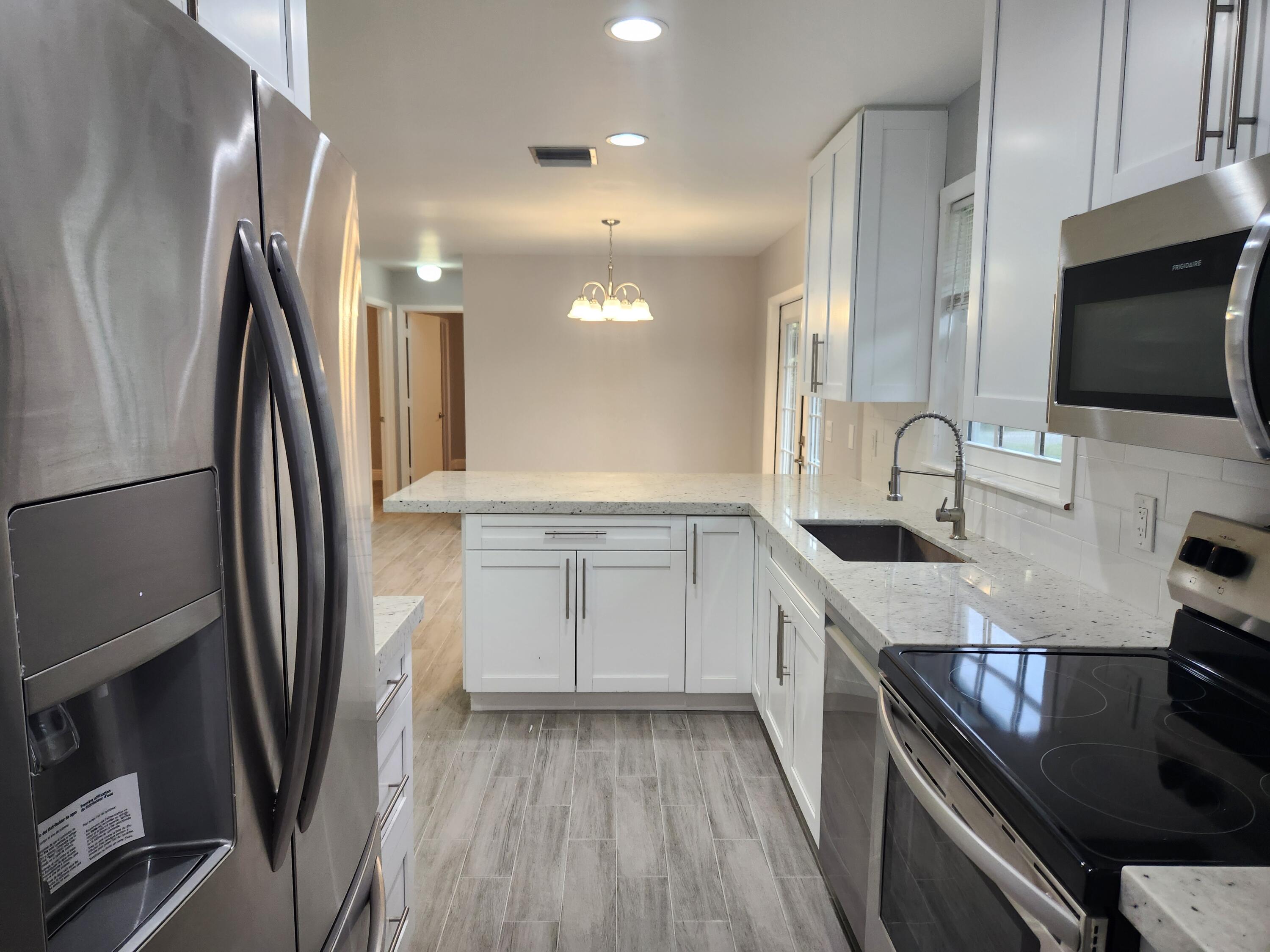 12745 165th Road North Jupiter, FL 33478 - Photo 8 of 13 Kitchen from Laundry