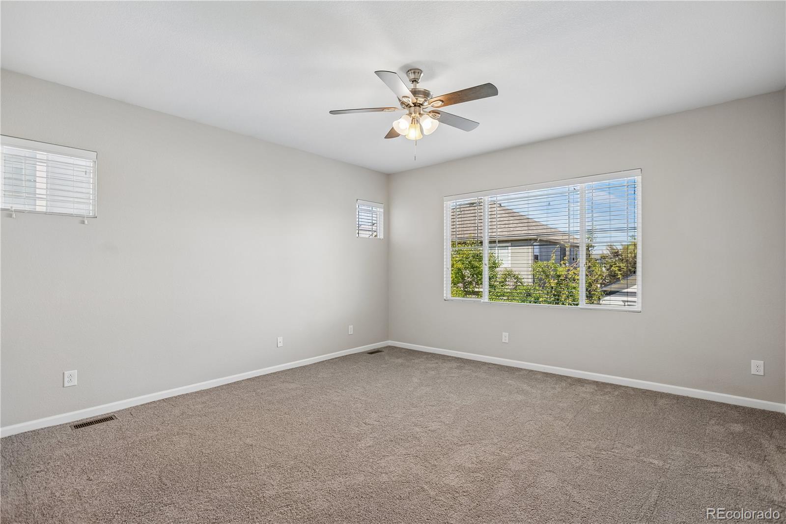 5031 South Rome Street Aurora, CO 80015 - Photo 27 of 39 a view of an empty room with a window