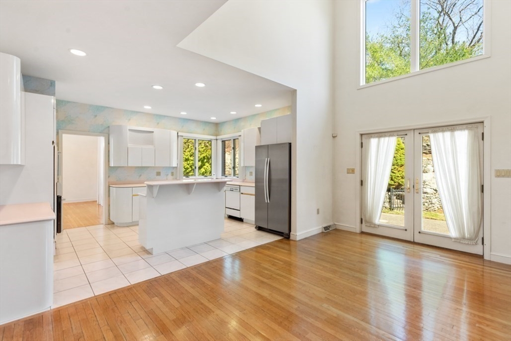 49 Forest Street Saugus, MA 01906 - Photo 15 of 42 a view of a kitchen with refrigerator and wooden floor