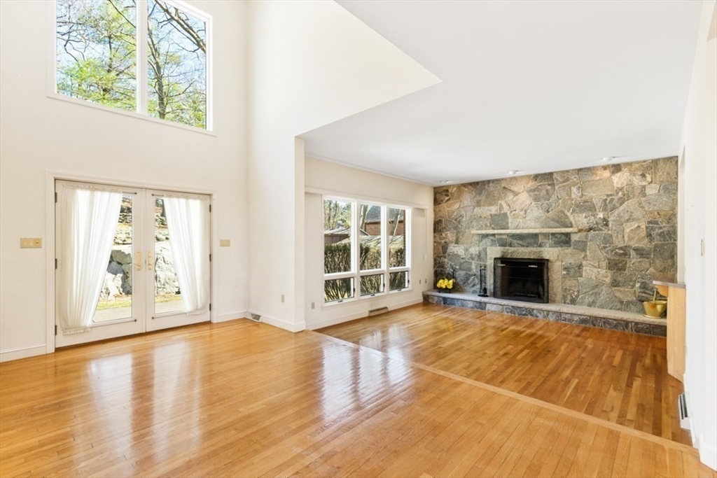 49 Forest Street Saugus, MA 01906 - Photo 16 of 42 a view of an empty room with a fireplace and a window
