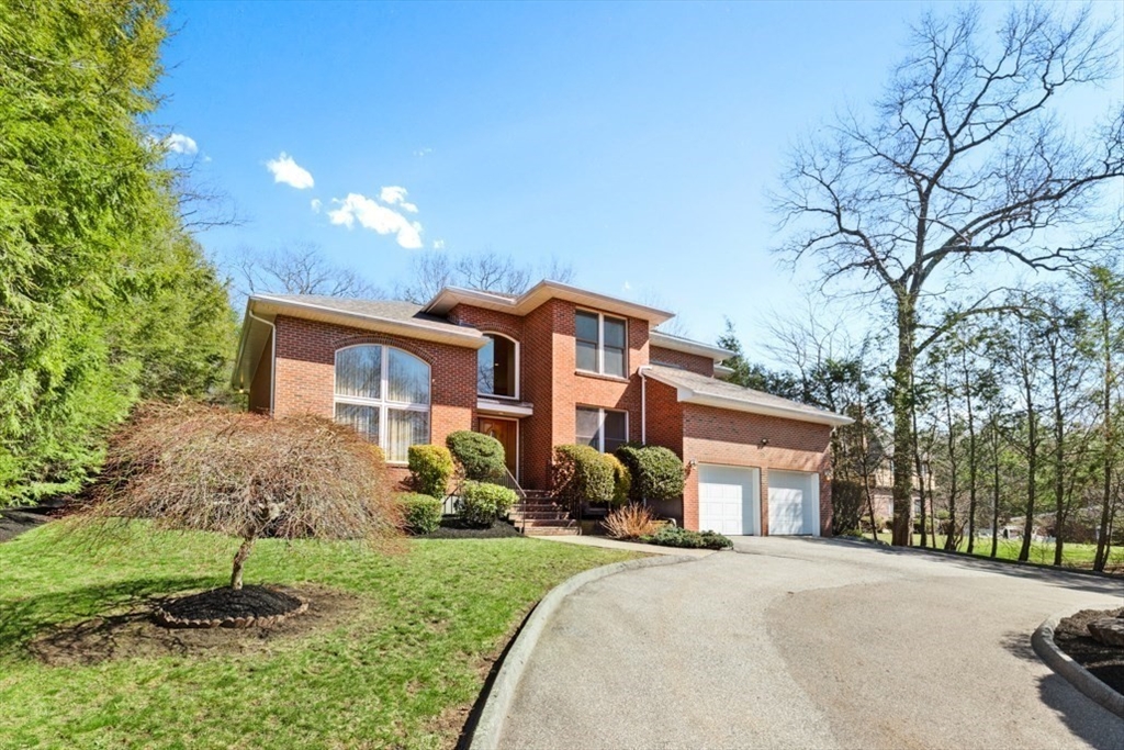 49 Forest Street Saugus, MA 01906 - Photo 2 of 42 a front view of a house with a yard and garage