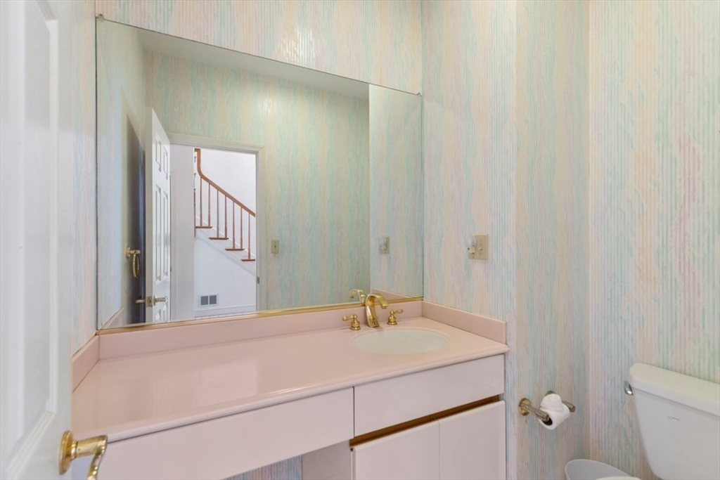 49 Forest Street Saugus, MA 01906 - Photo 21 of 42 a bathroom with a sink and a mirror