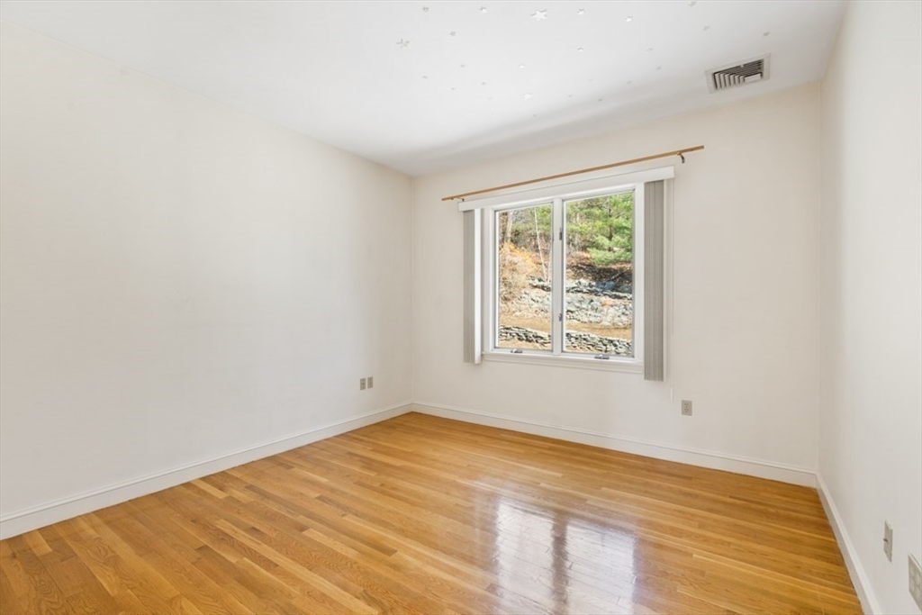 49 Forest Street Saugus, MA 01906 - Photo 26 of 42 an empty room with wooden floor and windows