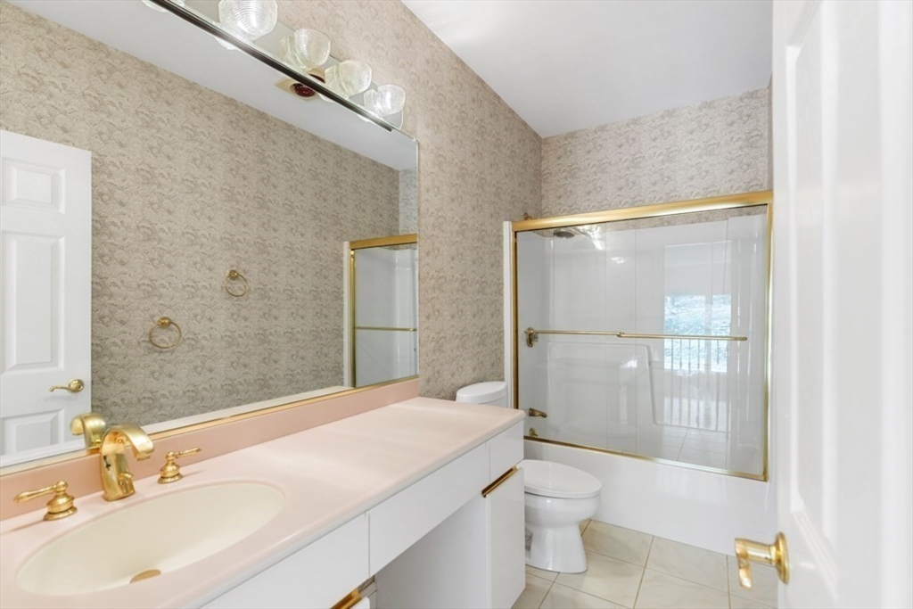 49 Forest Street Saugus, MA 01906 - Photo 28 of 42 a bathroom with a sink a toilet and shower