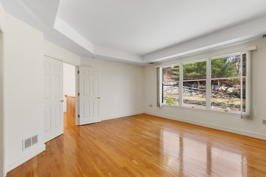 49 Forest Street Saugus, MA 01906 - Photo 30 of 42 a view of an empty room with wooden floor and a window