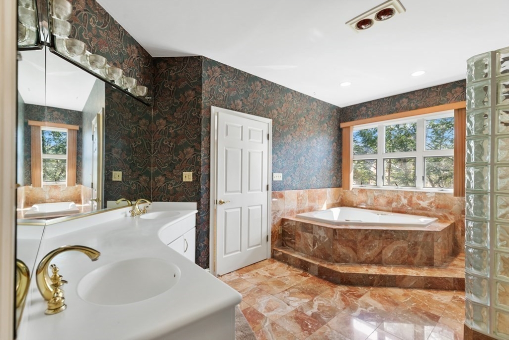49 Forest Street Saugus, MA 01906 - Photo 31 of 42 a spacious bathroom with a tub and sink