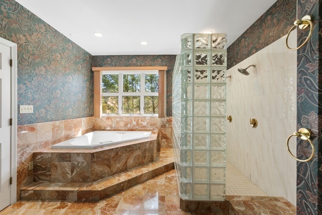 49 Forest Street Saugus, MA 01906 - Photo 32 of 42 a bath tub sitting in a bathroom next to a window