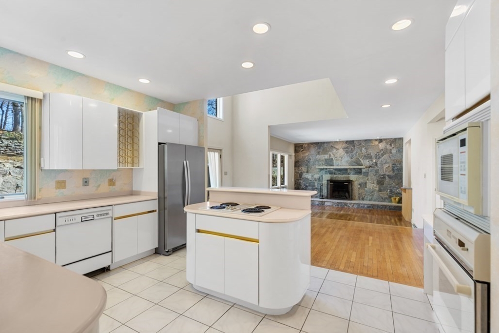 49 Forest Street Saugus, MA 01906 - Photo 10 of 42 a kitchen that has a sink cabinets and stainless steel appliances