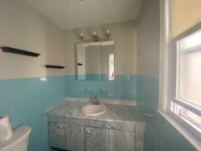 a bathroom with a sink and mirror