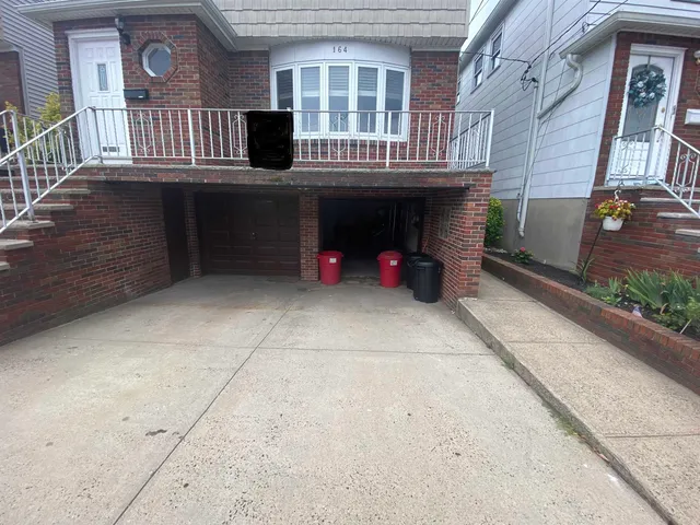 a view of deck with a table and chairs and potted plants
