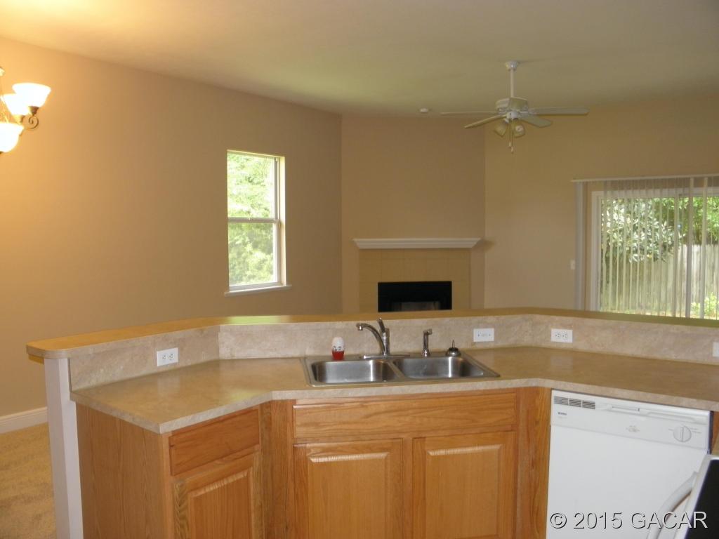 14277 Northwest 9th Road Newberry, FL 32669 - Photo 12 of 16 kitchen to living room