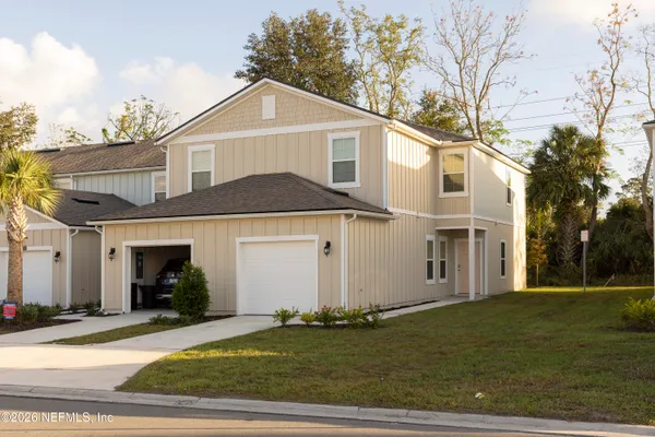 a front view of a house with a yard