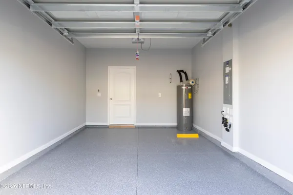 a view of en suite bathroom with a sink and glass door