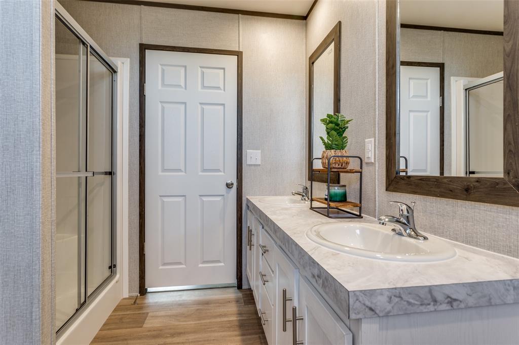 175 Cedar Drive Azle, TX 76020 - Photo 18 of 25 a bathroom with a sink and a mirror