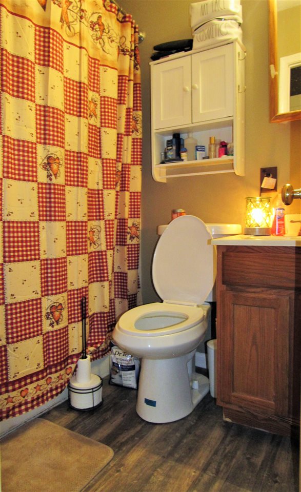 17 Hayrick Road Waynesboro, VA 22980 - Photo 5 of 16 a bathroom with a toilet sink and mirror