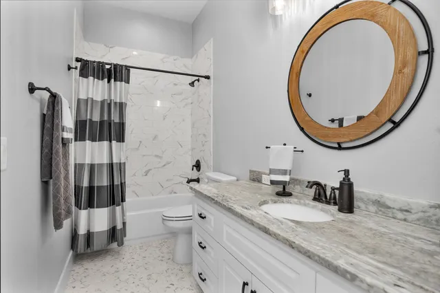 a view of a house with backyard porch and sitting area