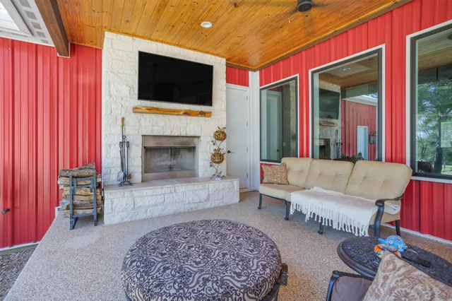 a bathroom with a granite countertop toilet sink and mirror