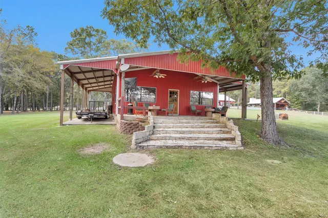 a view of a patio with table and chairs with wooden floor