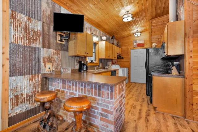 a spacious bathroom with a tub a double vanity sink and a mirror