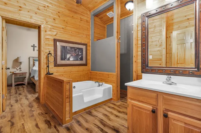 a view of a wooden deck with furniture