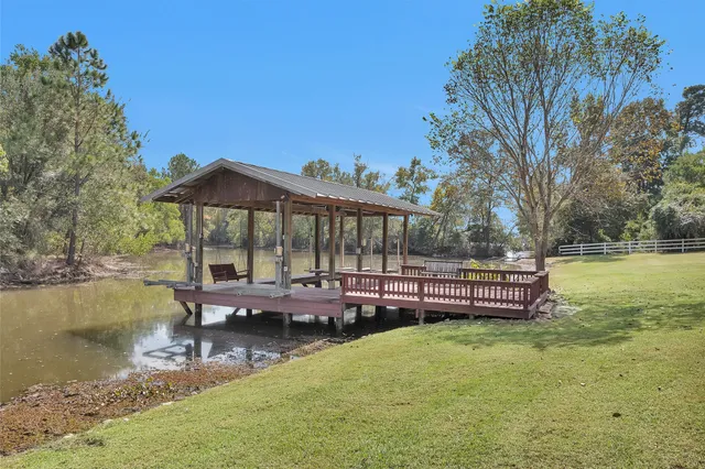 a view of a lake with a yard and mountain view